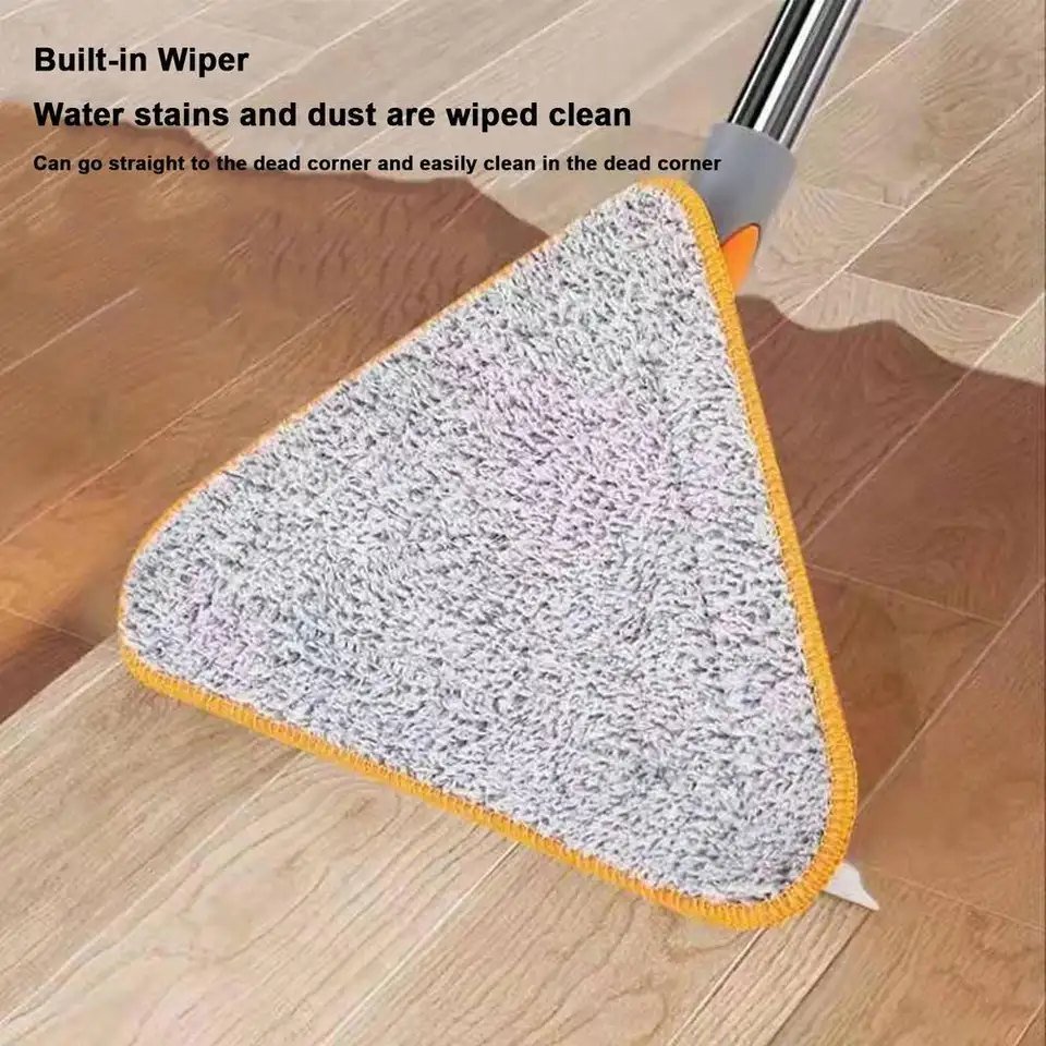 Triangle mop with a microfiber pad and squeegee edge wiping a spill on a wooden floor