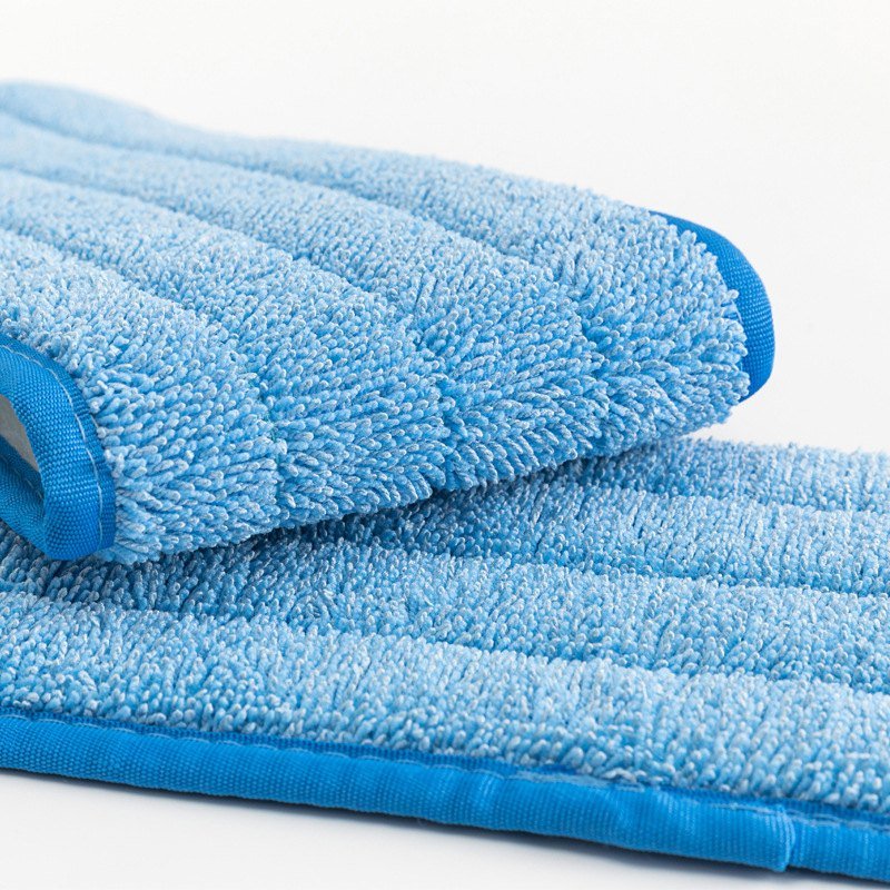 Close-up of the blue twisted-yarn microfiber face and bound edge of the mop pad