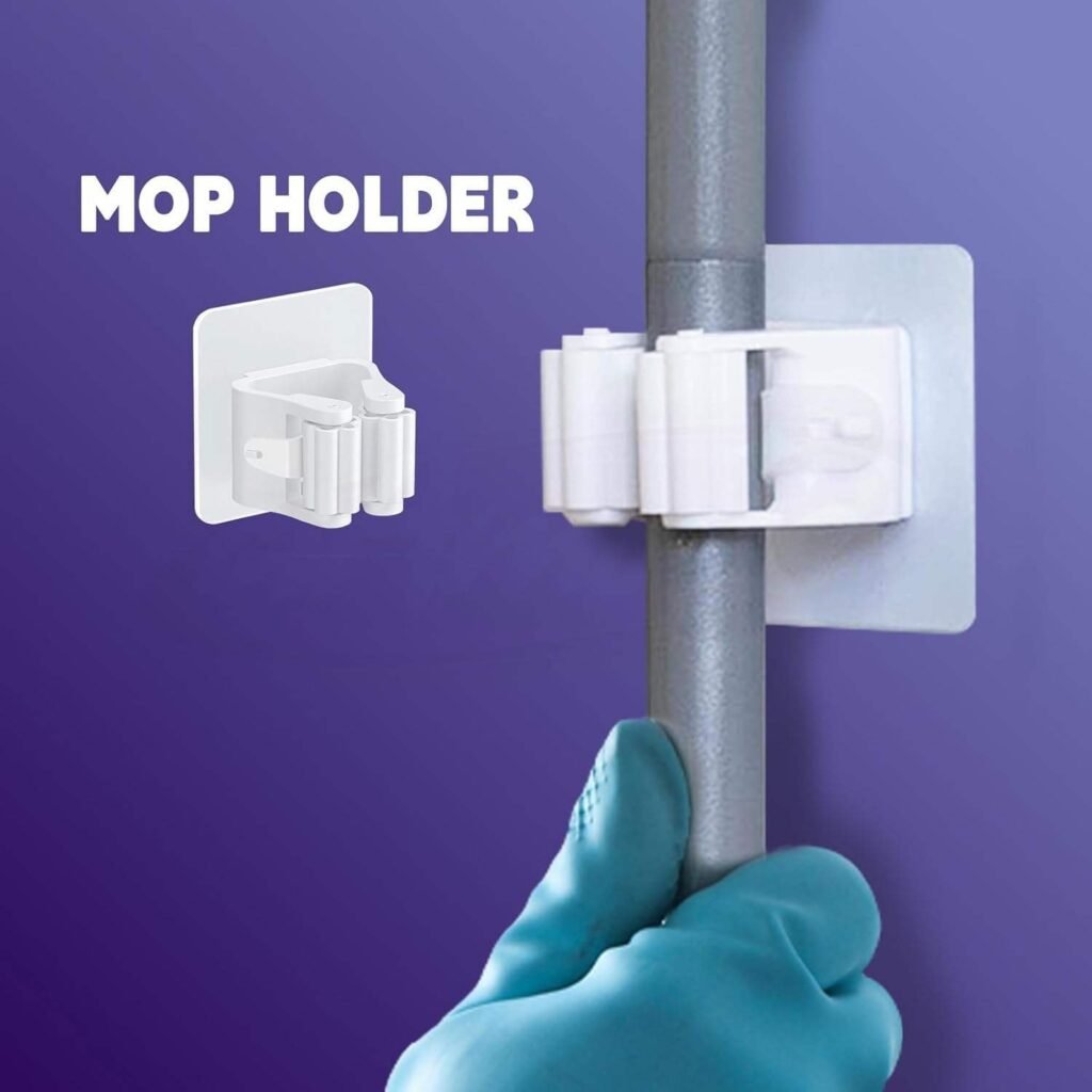 Adhesive wall holder gripping the grey aluminium pole of the clamp mop