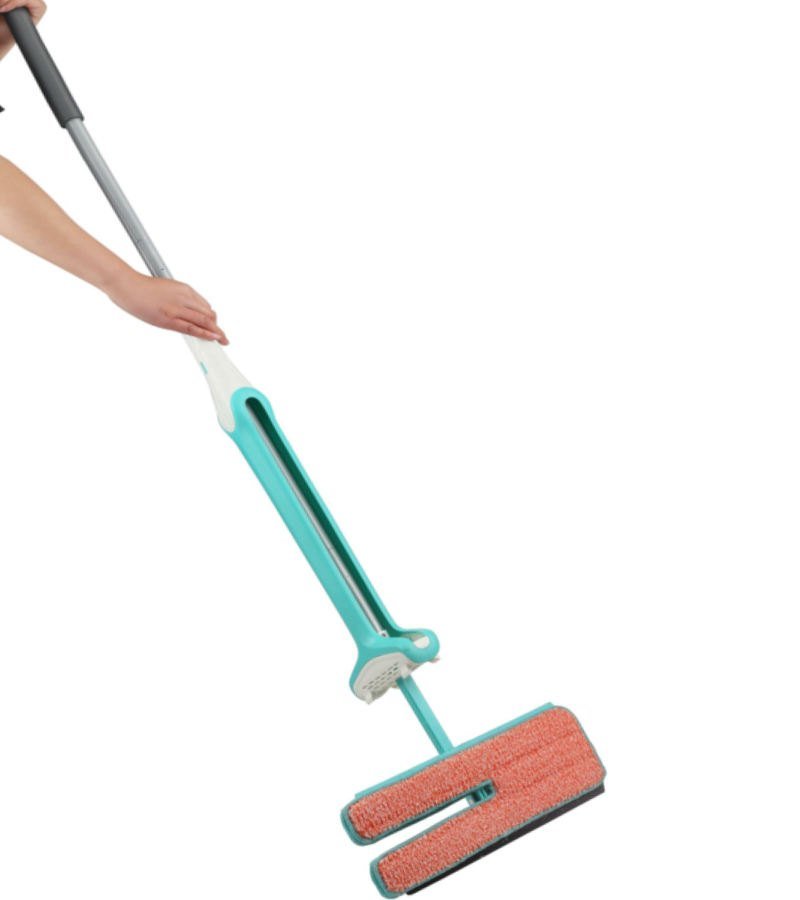 Split-head squeeze mop flipped to its orange microfiber face, held by the pole