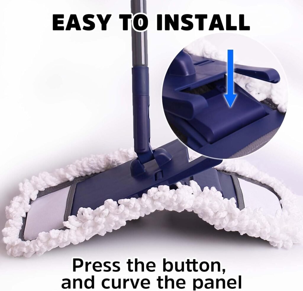 Pressing the button to fold the flat mop head before fitting the pad