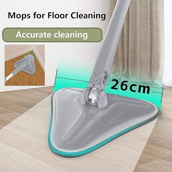 Grey triangle mop head measuring 26 cm cleaning a wooden floor