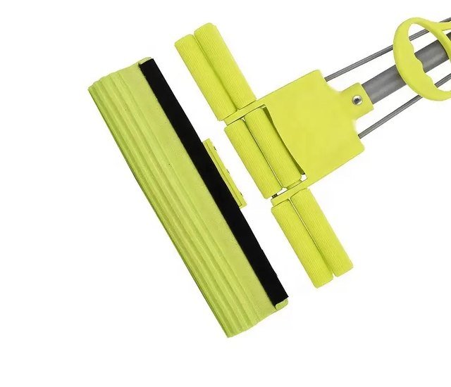 PVA sponge head taken off the green double-roller mop frame, showing its backing strip