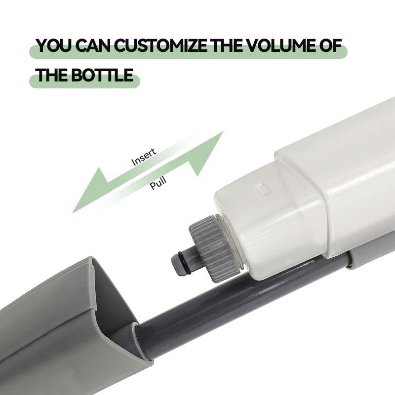 Removable bottle of the grey spray mop being pushed onto its connector on the pole