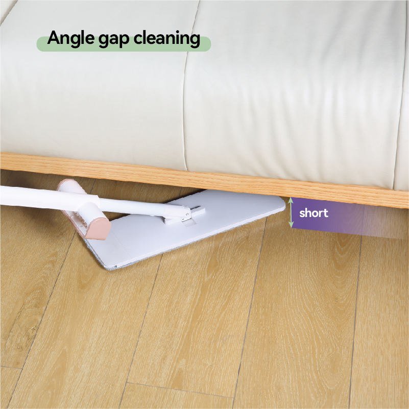 Slim flat mop head slid into the low gap under a cream sofa