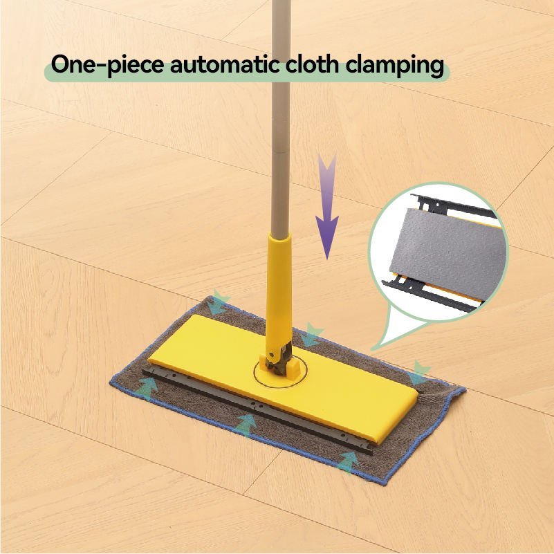 Pressing the flat mop handle clamps the grey cloth along both plate edges