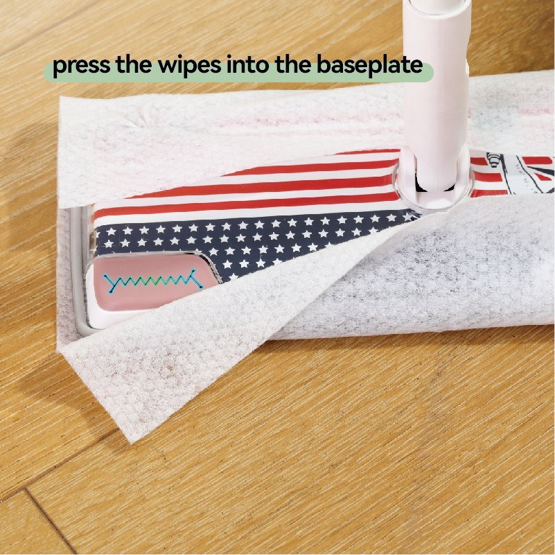 Disposable wipe being pressed into the corner gripper of the printed flat mop baseplate