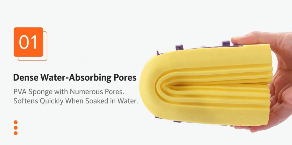 Yellow PVA sponge mop head folded in a hand, showing its dense pores