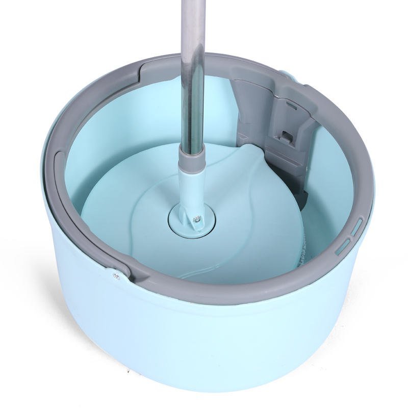 Light blue round spin mop bucket from above with the mop plate on its platform