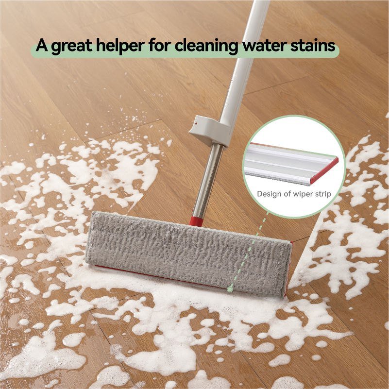 Flat mop pushing soapy water on a wooden floor, with the wiper strip shown close up