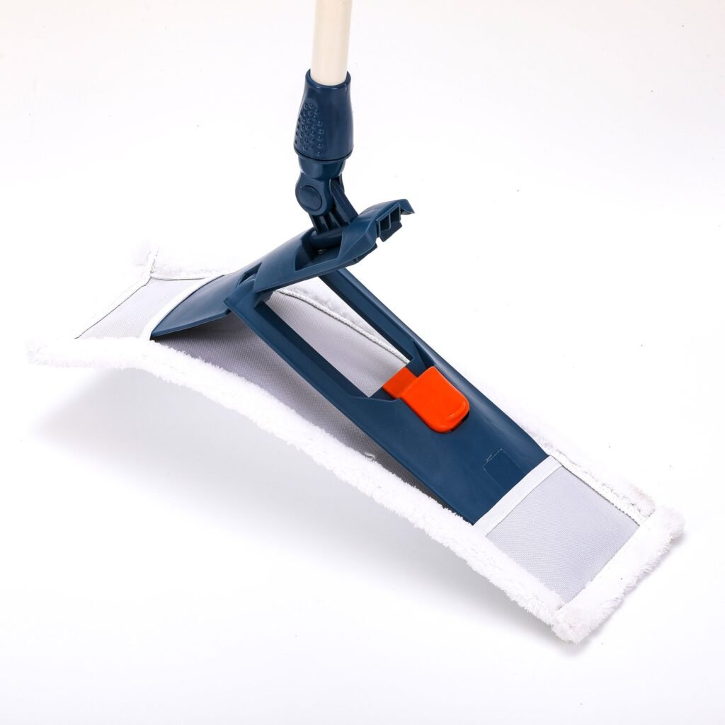 Navy folding flat mop frame with orange slider, partly folded in a white pad