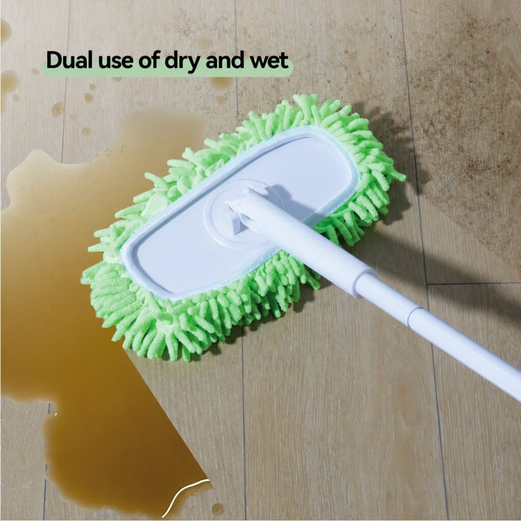 Chenille cover of the flat dust mop wiping up a spill on a tiled floor