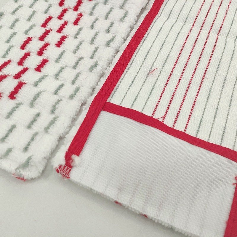 Close-up of the red and grey pile and striped back with red binding