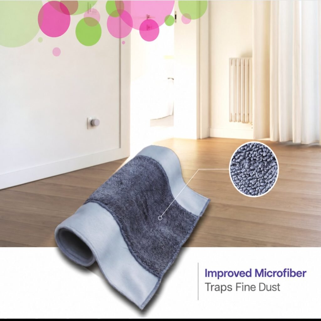 Grey microfiber pad of the clamp flat mop on a wooden floor, with a pile close-up