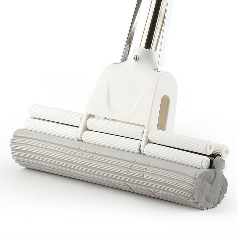 Close-up of the sponge mop head with three rows of white rollers over grey PVA sponge