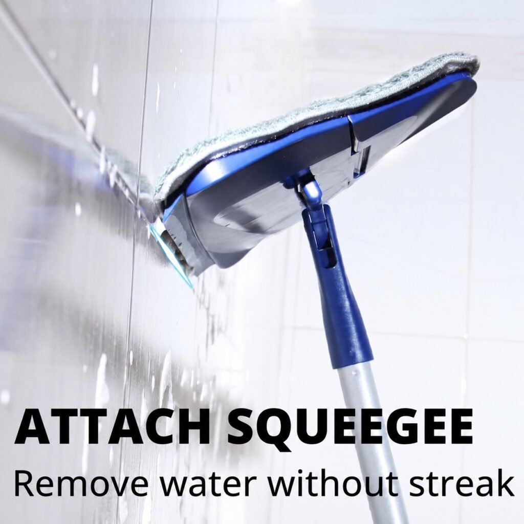 Squeegee edge of the triangle wall mop head wiping water off a tiled wall