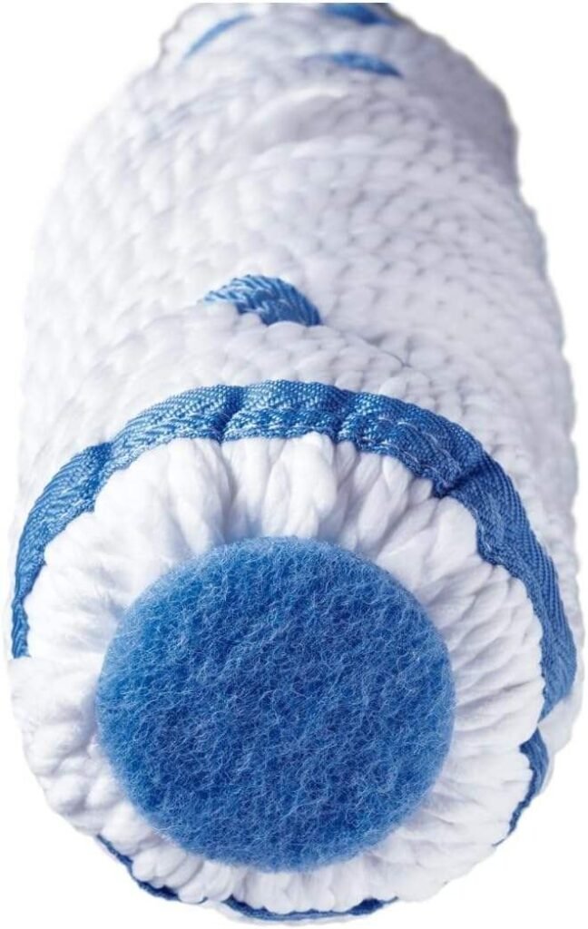 Close-up of the twist mop head showing the round blue scrub pad in its tip