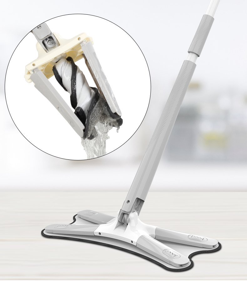 X-shape flat mop on a floor, with an inset of the head folded and wrung in its sleeve
