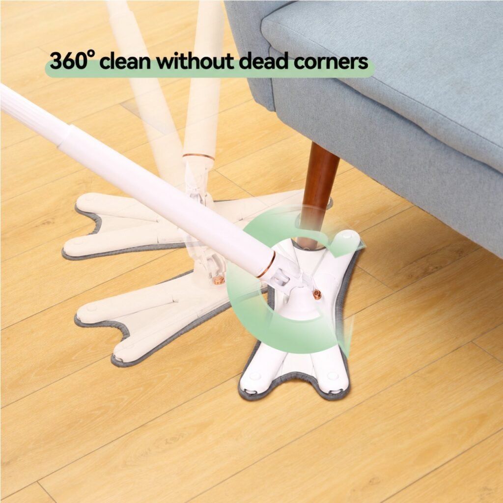 X-shaped flat mop head turning 360 degrees around a sofa leg on a wooden floor